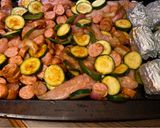 A picture of step 4 of Sheet pan barbecue chicken and sausage.