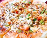 A picture of step 7 of Chicken Tikka pizza.