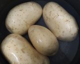 A picture of step 1 of Baked Potatoes with Ham, Cream, and Cheese.
