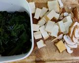 A picture of step 1 of Banh Canh with Mushrooms, Tofu, and Seaweed.