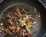 A picture of step 1 of My version of Thai Basil Beef (Pad Ka Prao) with dried chillies, topped with fried eggs.