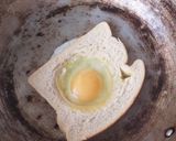 A picture of step 1 of Egg in a hole sandwich.