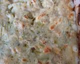 A picture of step 4 of Potato, cauliflower, cabbage cheesy bake.