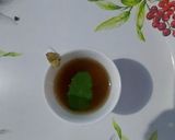A picture of step 3 of Cardamom and tulsi tea.