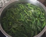 A picture of step 1 of Strapatsada with Tomato and Amaranth Greens.