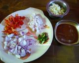 A picture of step 1 of Bhindi and Shallots Masala.