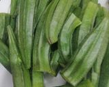 A picture of step 1 of Masala bhindi.