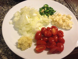 Dandelion Ka Saag. with grape tomatoes and blue cheese