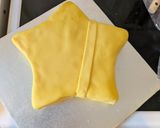 A picture of step 13 of Mario super star cake.