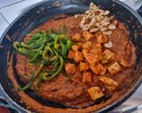 A picture of step 6 of Paneer cashew capsicum in curd based gravy.
