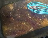 A picture of step 2 of Sticky red wine, rosemary and thyme gravy.
