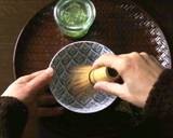 Preparing a cup of Matcha on a table recipe step 3 photo
