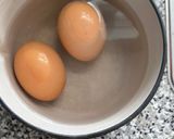 A picture of step 1 of Fridge raid curried egg wrap.