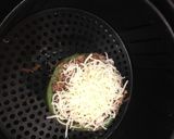 A picture of step 5 of Shaved beef stuff pepper with white Queso cheese.
