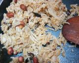 A picture of step 11 of Peanut rice with bundi raita.