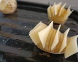 A picture of step 4 of Oven Roasted Potatoes with Cheese.