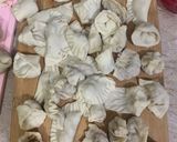 A picture of step 11 of Dumplings served with chilli oil and soya sauce dipping.