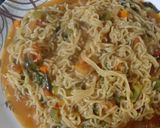 A picture of step 2 of Spicy maggie with lots of veggies.