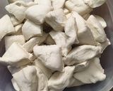 A picture of step 2 of Pizza monkey bread.