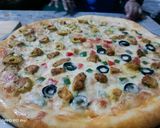 A picture of step 5 of Tikka n kabab pizza.