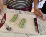 A picture of step 2 of Cucumber hummus boat.