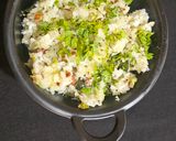 A picture of step 3 of Atukulu with coconut and cucumber in south style.