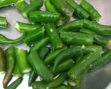 A picture of step 2 of Green chilli pickle.