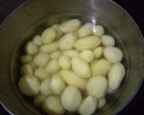 A picture of step 1 of Creamy garlic mashed potatoes with brown sugar baked Carrot's.