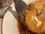 Ñoquis de batata rellenos con muzzarella y salsa bolognesa