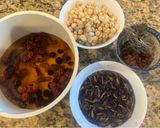 A picture of step 1 of Red Date and Dried Persimmon Sweet Soup with Butterfly Pea Flower Water.
