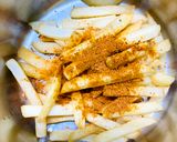 A picture of step 6 of Peri peri fries.
