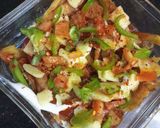 A picture of step 5 of Loaded Pizza fries.