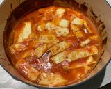 A picture of step 4 of Smokey tomato & halloumi bake.