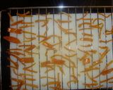 A picture of step 7 of Orange peels- dates and raisins chocolate candy.