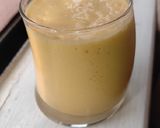 A picture of step 2 of Pineapple and mango smoothie, with ice cream.