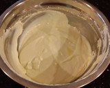 A picture of step 12 of Mocha Layer Cake with Whipped Mascarpone Cream and a Coffee Glaze Drizzle.
