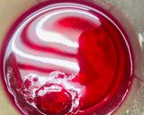 A picture of step 4 of Mangolecious raspberry jelly dessert.