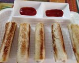 A picture of step 6 of Bread paneer cigars.