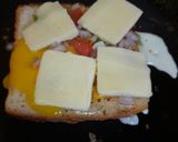 A picture of step 5 of Bread egg cheese grill slices.
