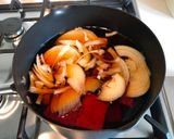 A picture of step 5 of Japanese style pork & tofu nimono.