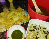 A picture of step 5 of Gol Gappy with aloo Chana chat and khata and green chutney.