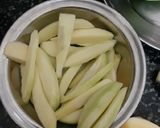 A picture of step 1 of Raw mango sabzi.