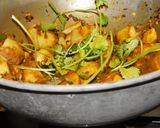 A picture of step 4 of Aloo ke gutke-special potato masala curry for chapathi.