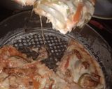 A picture of step 9 of Chickn tikka pizza.