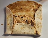 A picture of step 4 of Loaded Mexican Tortilla Pinwheels.