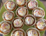 A picture of step 6 of Strawberry cupcakes with vanilla frosting and sprinkles.