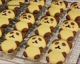 A picture of step 14 of Adorable 3D Panda Cookies.