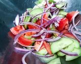 A picture of step 1 of Creamy Cucumber and Tomato Salad.