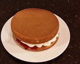 A picture of step 17 of Vanilla Lemon Raspberry Layer Cake with Whipped Cream Buttercream Frosting.