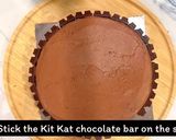 A picture of step 15 of Kit Kat Chocolate cake.